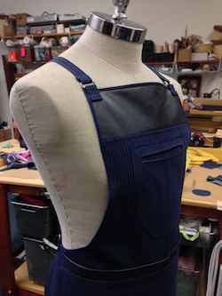 Traditional shop apron on tailoring model.