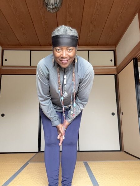 Pilgrim bowing in farmhouse room on Shikoku.