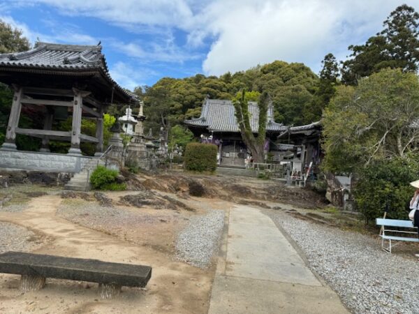 A mixture of volcanic rock flow, gravel. and concrete surfaces at the temple.