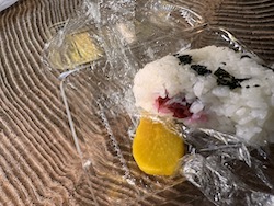 Rice ball with pickled beet filling.