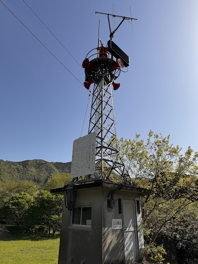 An emergency warning tower on the mountain trail.