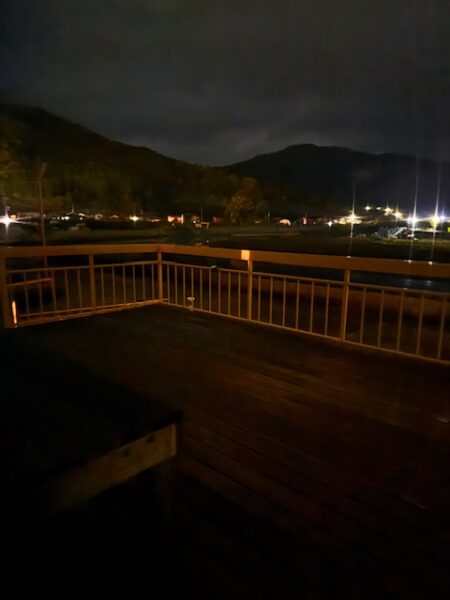 Rainy night view of deck in back of hostel.