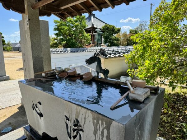 Stone fountain at one of the city temples in Imabari.