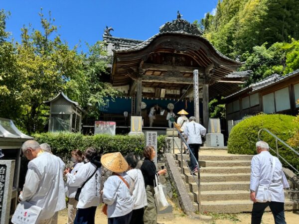 A pilgrim group arriving at one of Imabari's city temples.