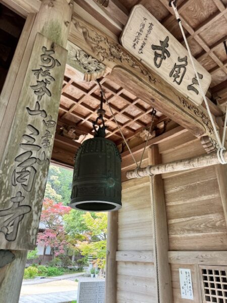 Temple bell hanging at gate at Sankaku-ji.