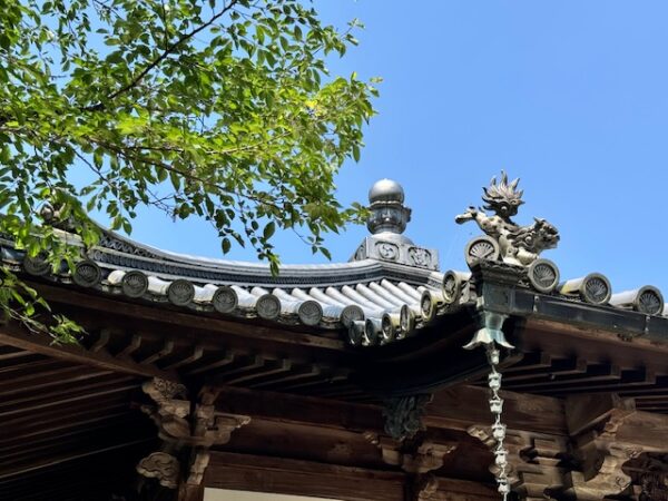 Fancy roofline on renovated Japanese temple building on Shikoku.