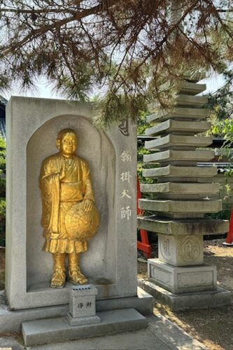 Golden Kukai at temple 80, home of the 7-storied pagoda.