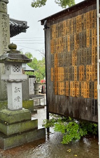 Rain soaked hanging ema plaques.