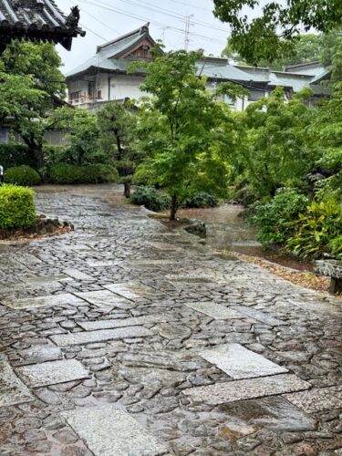 Stone tiles during rain at temple.