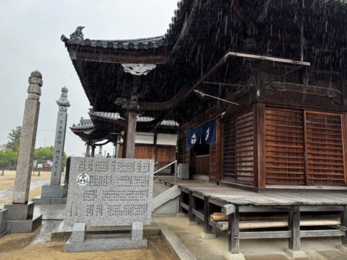 The rain and overcast sky create a mellow mood at the main hall at temple 87 on Shikoku pilgrimage.