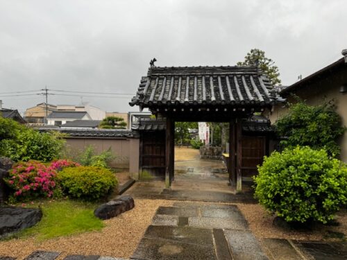 The rain and overcast sky create a mellow mood at the east gate at temple 87 on Shikoku pilgrimage.