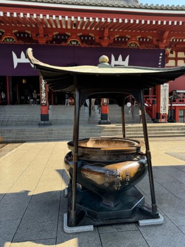 Main hall with purple banner at Senso-ji temple in Tokyo.2