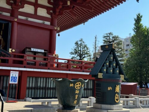 Grren structures in front of main hall at Senso-ji temple in Tokyo.