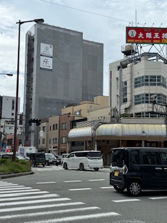 A busy street and buildings in Osaka city.