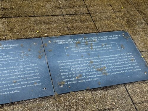 Plaque at Memorial Cenotaph at Hiroshima Memorial Peace Park.