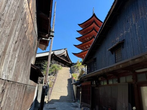 Buildings overshadowed by pagoda at Itsukushima Shrine at Miyajima.