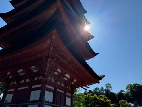 Sun beaming off of pagoda at Miyajima.